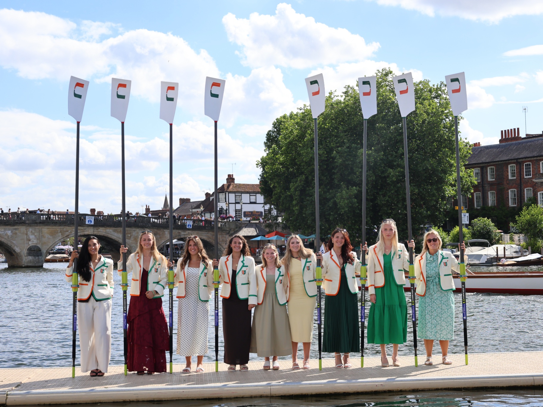 UM Rowing team with crested oars at Henley